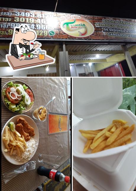 A imagem da comida e exterior a Padaria e Restaurante Praieira