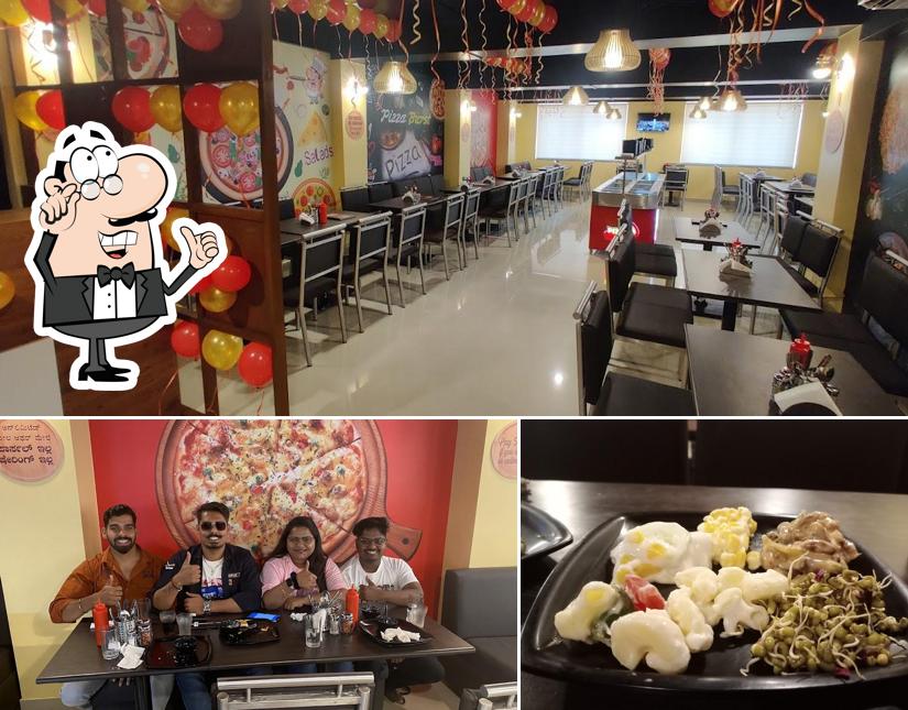 Take a seat at one of the tables at Pizza Burst