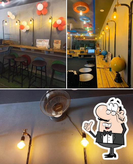 Take a look at the picture displaying interior and food at The3GareebsGantu Cafe