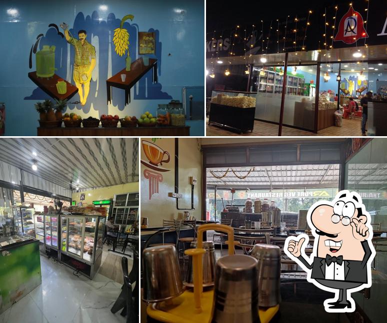 Take a seat at one of the tables at AR Vegetarian Restaurant and Bakery