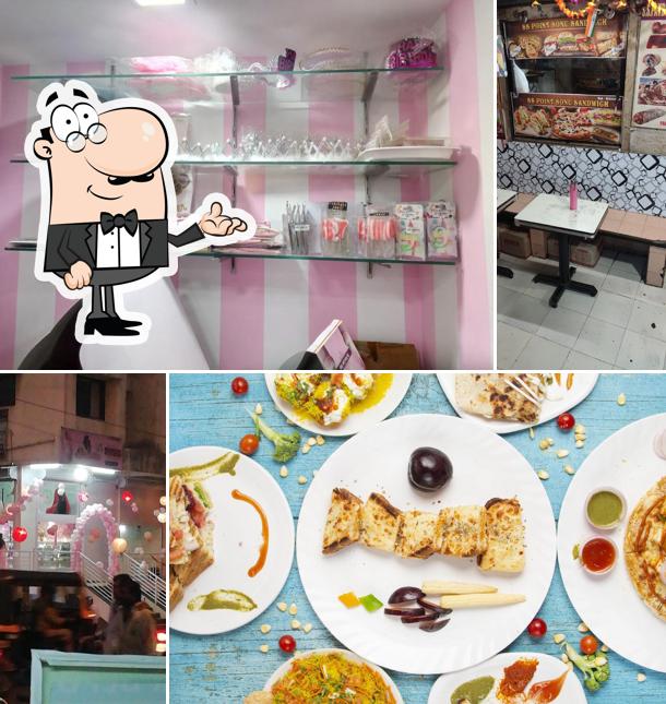 Take a seat at one of the tables at S.S. point ( Sonu Sandwich)