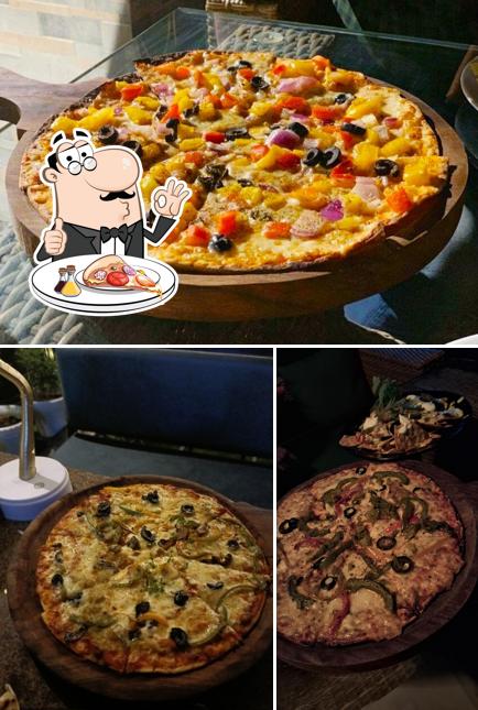 Get pizza at Zarza Club and Terrace Jaipur