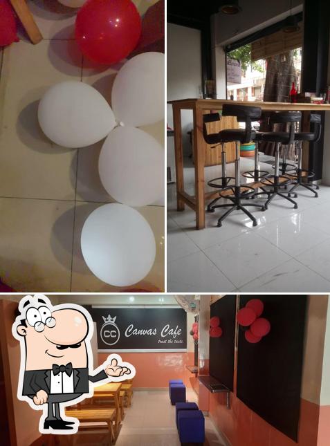 Take a seat at one of the tables at Canvas Cafe