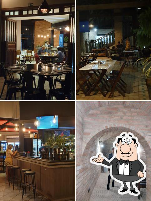 Sente em uma das mesas no Restaurante Coroneto The Bbq House