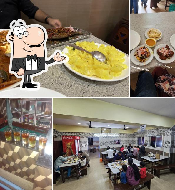 Take a seat at one of the tables at Usthad Hotel