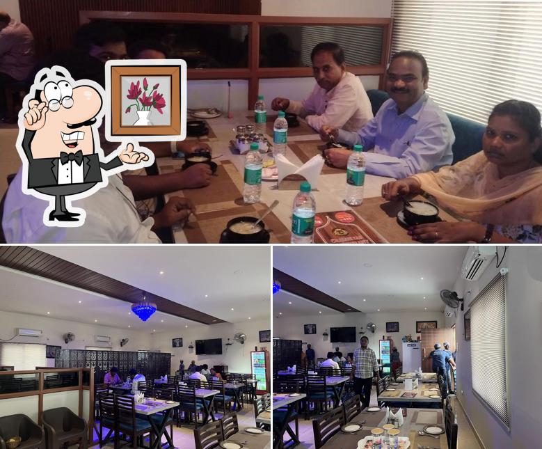 Take a seat at one of the tables at Chalukyas Restaurant