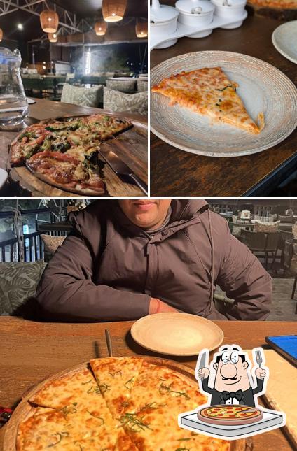 Get pizza at Kita & Gucchi Cafe