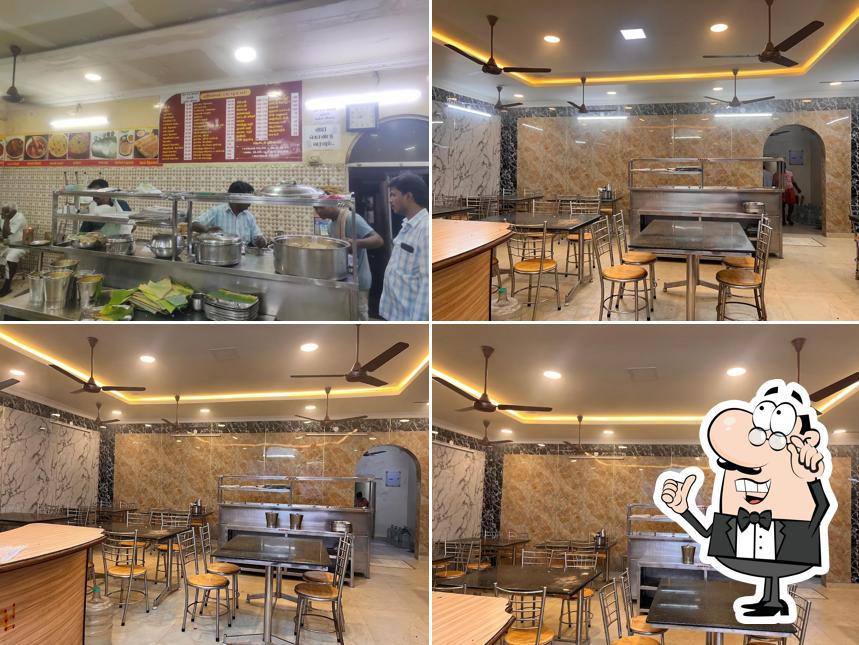 Take a seat at one of the tables at Shankar Hotel