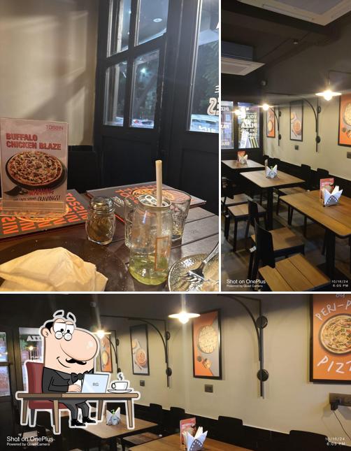 The interior of Tossin Pizza East Patel Nagar