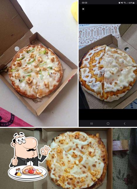 Try out pizza at Pizza Adda
