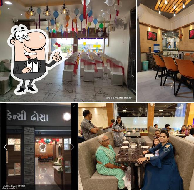 Take a seat at one of the tables at Hotel Shivbhumi
