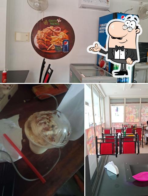 Check out the image showing interior and food at Chick Mania