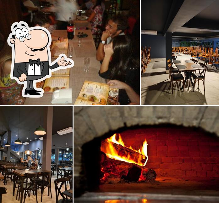 Sente em uma das mesas no Dmilano Pizzaria Forno a Lenha