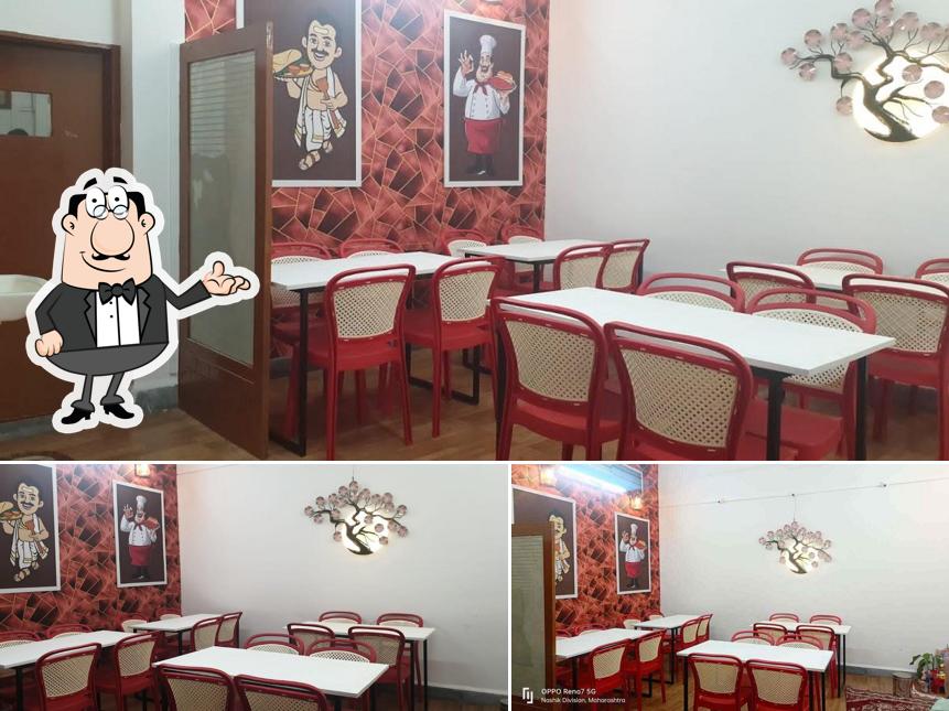 Take a seat at one of the tables at Nashik Swad Katta