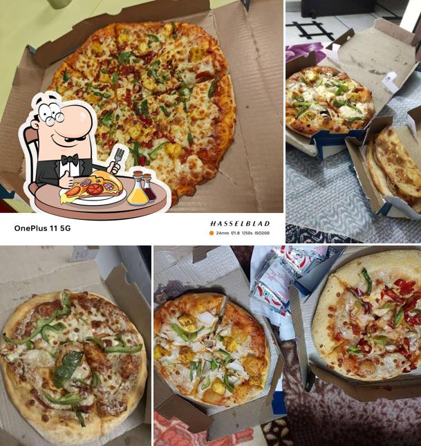Try out pizza at Domino's Pizza M.G. Mall, Sonipat
