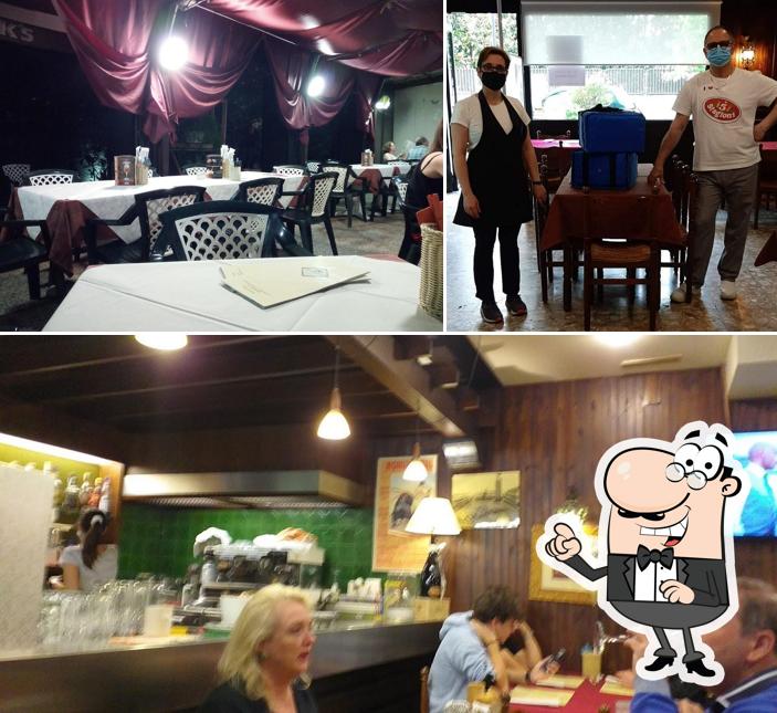 Pizzeria Petrarca si caratterizza per la interni e tavolo da pranzo