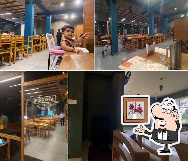 Take a seat at one of the tables at FUDISTA RESTAURANT