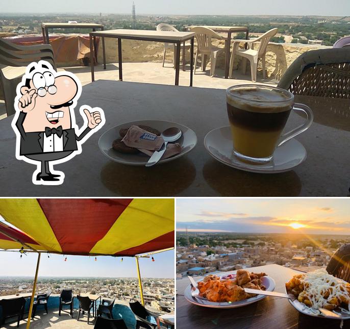 Take a seat at one of the tables at Kuku Coffee Shop