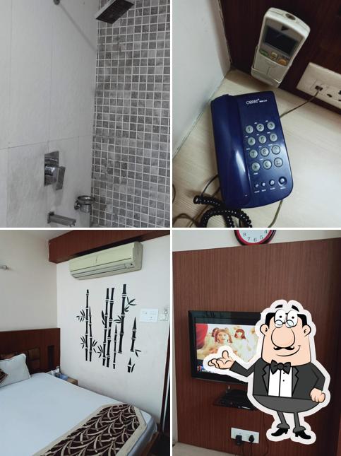 Take a seat at one of the tables at OYO Hotel Vaani Continental