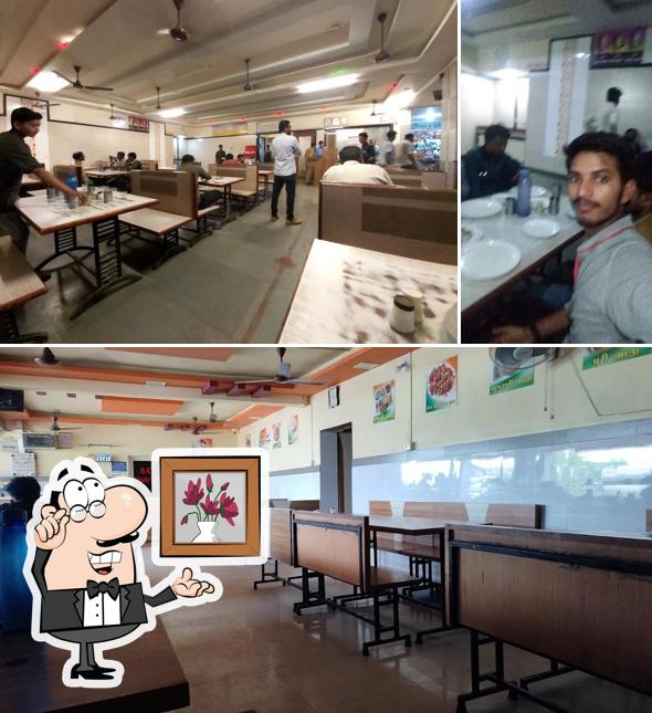 Among different things one can find interior and dining table at Hotel Tiranga