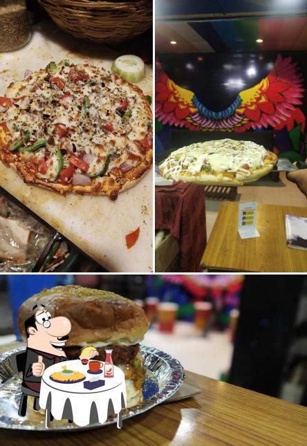Order a burger at The Desi Thath Cafe & Restaurant
