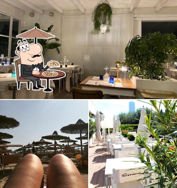 La foto di esterno e tavolo da pranzo da Ristorante Riviera