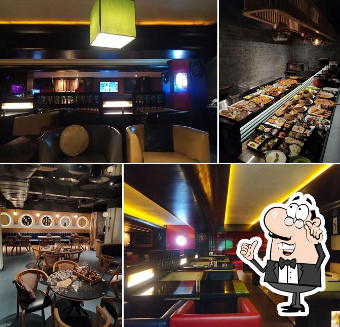 Take a seat at one of the tables at 60ML Sports Lounge & Bar