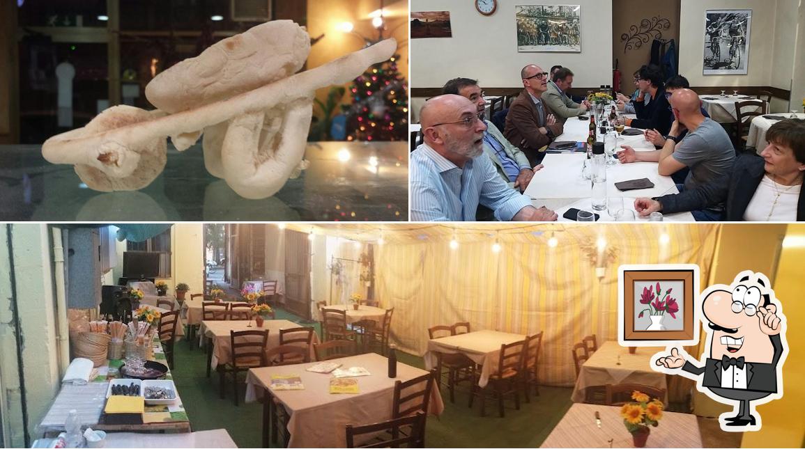 Guarda la immagine che presenta la interni e cibo di Pizzeria Trattoria Sichi Giuliano