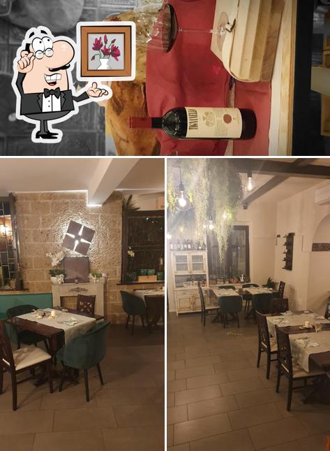 Questa è la immagine che mostra la interni e vino di D'Ari' Braceria