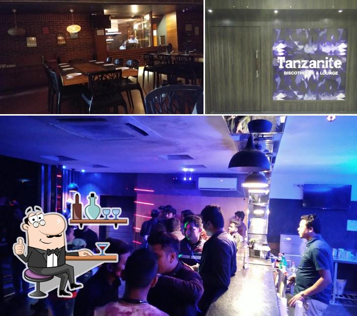 Take a seat at one of the tables at Novus Tanzanite - Bar & Discotheque