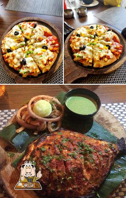 Try out pizza at Menaka FineDine