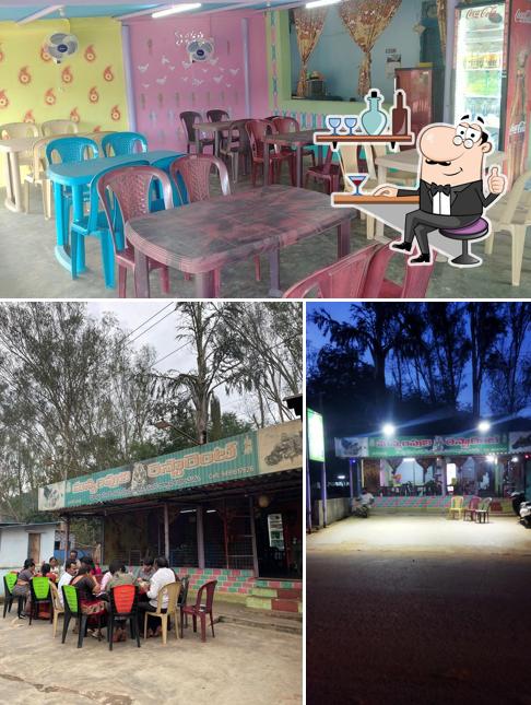 Take a seat at one of the tables at Manyam Puli Restaurant