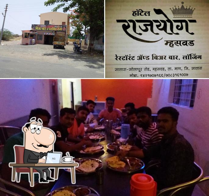 Take a seat at one of the tables at Rajyog Beer Bar
