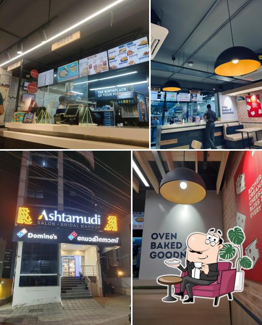 Take a seat at one of the tables at Domino's Pizza Kulathoor, Thiruvananthapuram