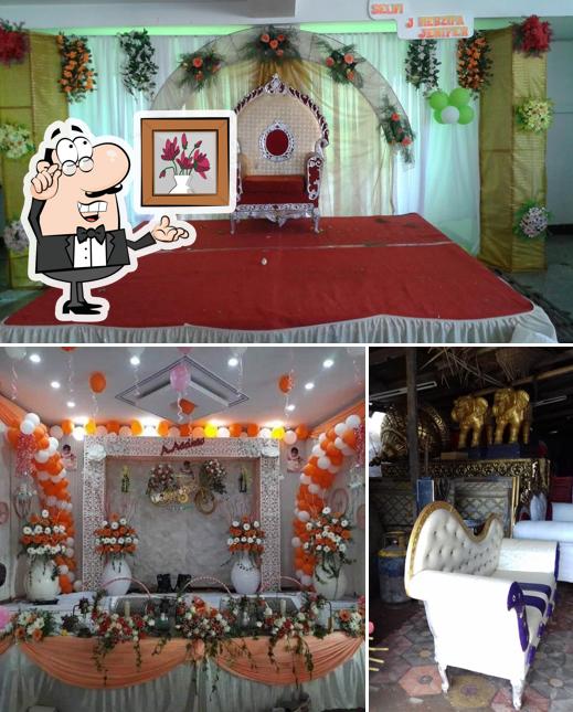 Take a seat at one of the tables at செந்தூர் ஶ்ரீ சிமாட்டி fish aquarium