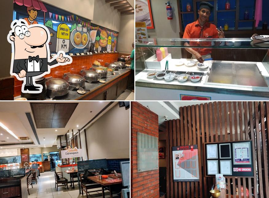 Take a seat at one of the tables at Barbeque Nation