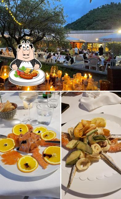 Tra le varie cose da Ristorante al Golf si possono trovare la cibo e interni