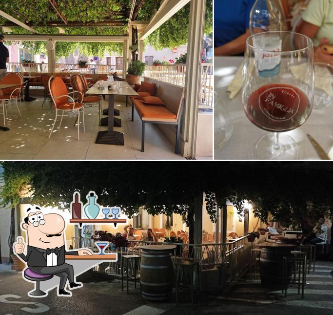 La foto della interni e bevanda di IN FAMIGLIA restaurant pizzeria