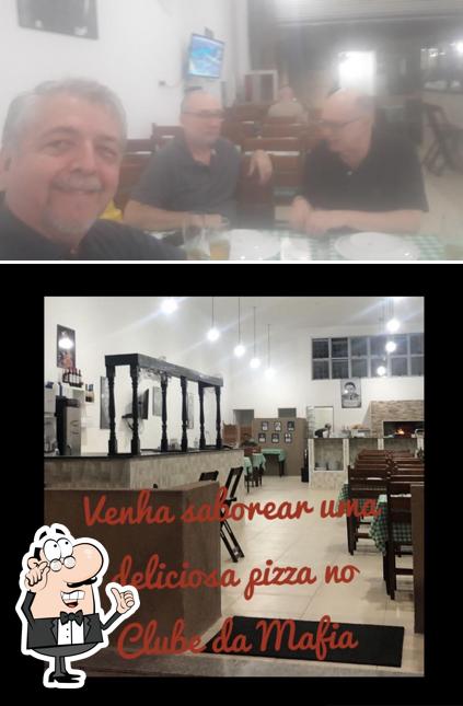 O interior do Pizzaria Clube da Máfia