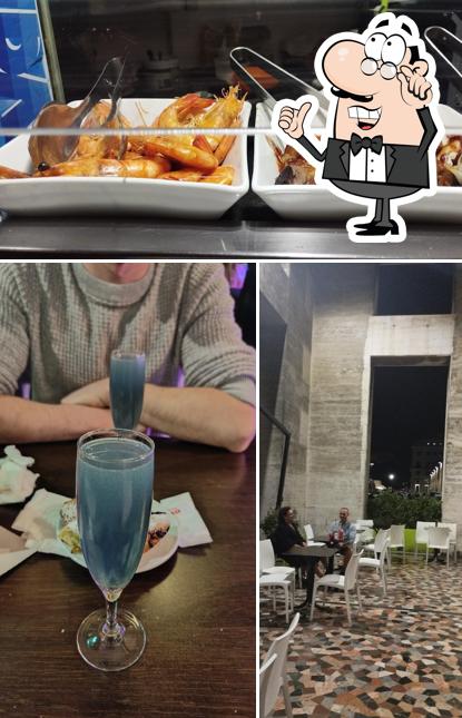 La foto della interni e cibo di Bar Cosmo