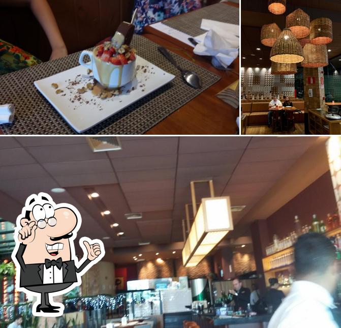 Sente em uma das mesas no Pizzaria Olegário - VILA DA SERRA