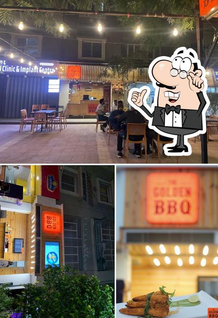 Take a seat at one of the tables at The Golden BBQ