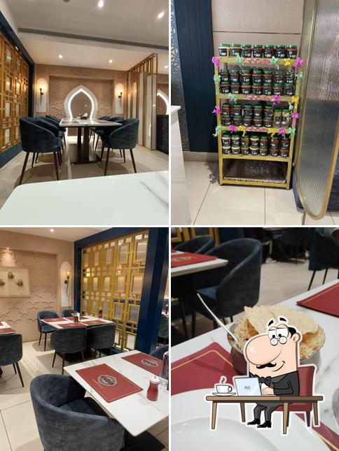 Take a seat at one of the tables at AL HAYAT RESTAURANT AND CATERERS