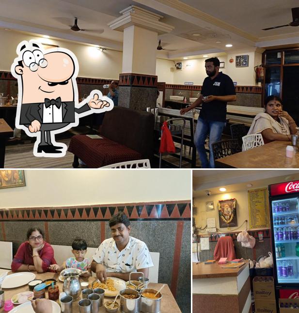 Take a seat at one of the tables at Jaya Sree Mess