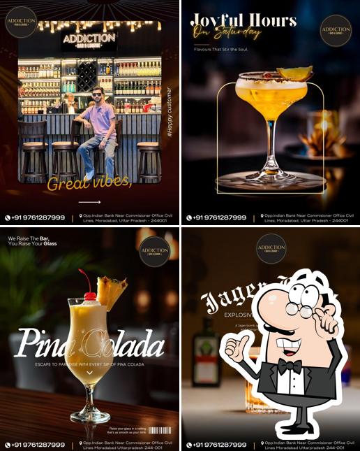 Take a seat at one of the tables at Addiction Bar & Lounge