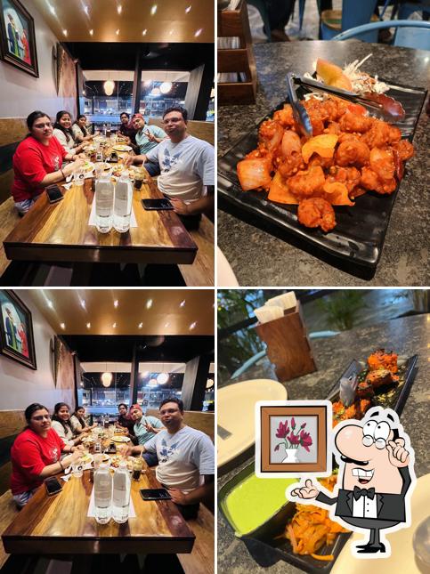 Take a seat at one of the tables at Birbal Darbar - Gunjur