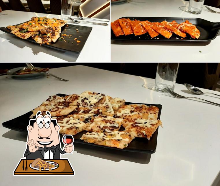 Try out pizza at Green Leaf Restaurant