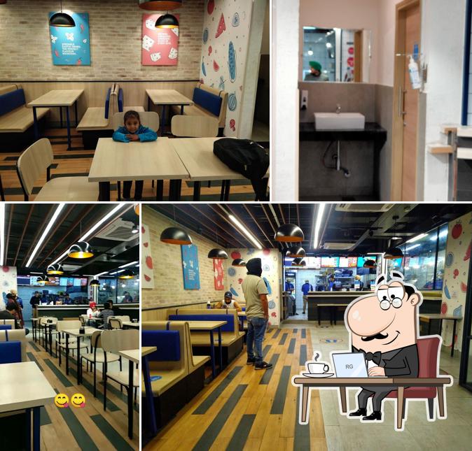 Take a seat at one of the tables at Domino's Pizza Civil Lines, Gurdaspur