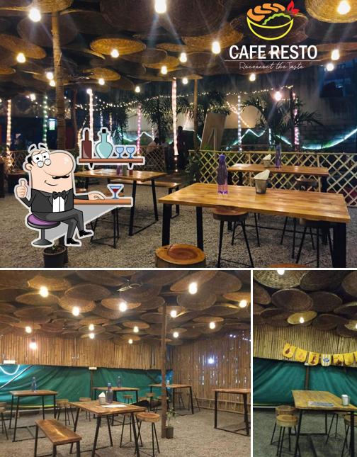 Take a seat at one of the tables at Cafe Resto