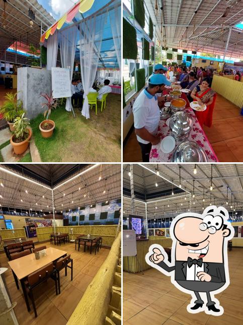 Take a seat at one of the tables at HOTEL PARAKH INN ( PURE VEG )